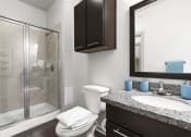 Thumbnail 6 of 14 - a bathroom with a sink toilet and shower