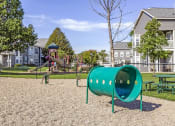 Thumbnail 35 of 42 - a playground with a slide and monkey bars in front of a house