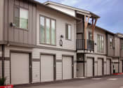 Thumbnail 47 of 47 - a row of garages in front of a building
