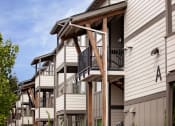 Thumbnail 46 of 47 - a view of a building with a balcony and a blue sky in the background