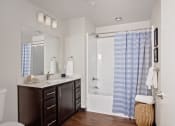 Thumbnail 21 of 47 - a bathroom with a sink toilet and shower