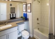 Thumbnail 25 of 25 - a bathroom with a toilet sink and bathtub