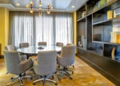 Thumbnail 6 of 25 - a conference room with a large table and chairs