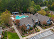 Thumbnail 2 of 40 - A large house with a pool in the backyard.
