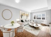 Thumbnail 5 of 28 - a living room with a couch and a table