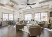 Thumbnail 8 of 28 - a living room filled with furniture and a ceiling fan