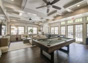 Thumbnail 11 of 28 - a large room with a pool table and couches