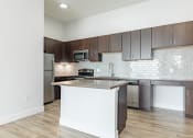 Thumbnail 13 of 30 - a kitchen with an island and stainless steel appliances at RockVue, Broomfield, Colorado