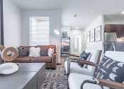 Thumbnail 6 of 30 - a living room with a couch and two chairs at RockVue, Broomfield, CO