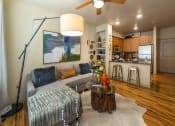 Thumbnail 18 of 28 - a living room filled with furniture and a ceiling fan at Retreat at Shadow Creek Ranch Apartments, Woodburn, Texas