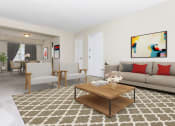 Thumbnail 1 of 12 - a living room with a couch and a coffee table at Parkland Village, Forestville, MD 20747