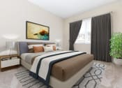 Thumbnail 4 of 12 - a bedroom with a bed and a window and a potted plant at Parkland Village, Forestville, MD 20747