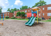 Thumbnail 8 of 12 - our apartments showcase a playground at Parkland Village, Maryland