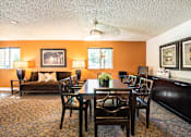 Thumbnail 15 of 24 - a dining room with a table and chairs at Eagles Landing Apartments, Everett, 98204