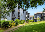 Thumbnail 22 of 24 - a path leading up to a row of apartment buildings at Eagles Landing Apartments, Everett, 98204