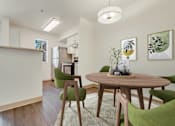 Thumbnail 18 of 22 - a living room and dining room with a table and chairs at Sage Apartments, Everett
