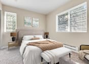 Thumbnail 21 of 22 - a bedroom with a large bed and two windows at Sage Apartments, Washington