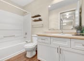 Thumbnail 22 of 22 - a white bathroom with a toilet and a sink at Sage Apartments, Washington
