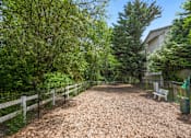 Thumbnail 11 of 22 - the path to the yard with a bench and a fence at Sage Apartments, Washington