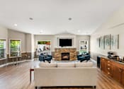 Thumbnail 5 of 22 - a living room with a couch and chairs and a fireplace at Sage Apartments, Washington, 98204