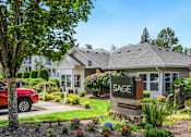 Thumbnail 1 of 22 - the sag building with a sign in front of it at Sage Apartments, Everett, WA
