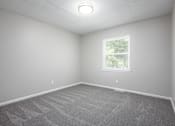 Thumbnail 16 of 16 - an empty room with carpet and a window