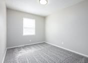Thumbnail 15 of 16 - an empty room with white walls and a window