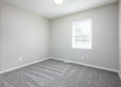 Thumbnail 11 of 16 - an empty room with carpet and a window
