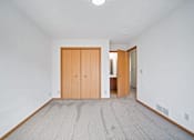 Thumbnail 46 of 60 - a room with a bathroom and a wooden door