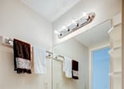 Thumbnail 41 of 43 - A white bathroom with a sink and mirror.