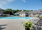 Thumbnail 18 of 43 - A pool area with a clear blue sky above.