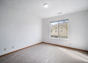 Thumbnail 42 of 60 - a room with white walls and a window