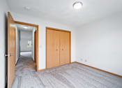 Thumbnail 44 of 60 - a living room with a door to a bedroom and a hallway