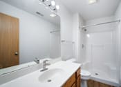 Thumbnail 50 of 60 - a bathroom with a sink and a shower and a toilet