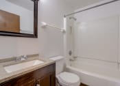 Thumbnail 35 of 47 - a bathroom with a sink toilet and bathtub