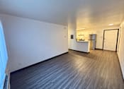Thumbnail 20 of 27 - A room with a grey floor and white walls.
