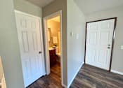 Thumbnail 25 of 27 - A white door is on the left and a brown door is on the right.