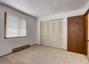 Thumbnail 38 of 47 - a bedroom with two closets and a window