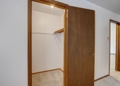 Thumbnail 42 of 47 - a walk in closet in a bedroom
