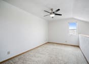 Thumbnail 43 of 60 - a room with white walls and a ceiling fan