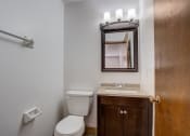 Thumbnail 40 of 47 - a bathroom with a toilet sink and mirror