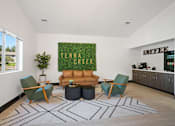 Thumbnail 13 of 60 - a living room with a couch and chairs and a green rug