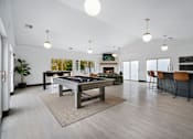 Thumbnail 19 of 60 - a large living room with a pool table and a bar
