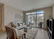 Thumbnail 18 of 64 - an aerial view of a living room with a staircase and a large window