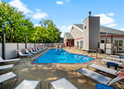 Thumbnail 28 of 60 - our apartments have a large pool and lounge chairs