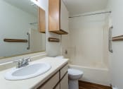 Thumbnail 11 of 19 - a bathroom with a sink and a toilet and a shower