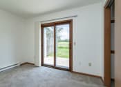 Thumbnail 9 of 19 - an empty living room with a door to a patio