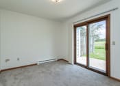 Thumbnail 10 of 19 - an empty living room with two large windows