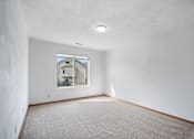 Thumbnail 45 of 60 - a room with white walls and a window and a carpet