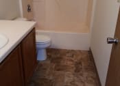 Thumbnail 2 of 5 - a small bathroom with a toilet sink and bathtub
